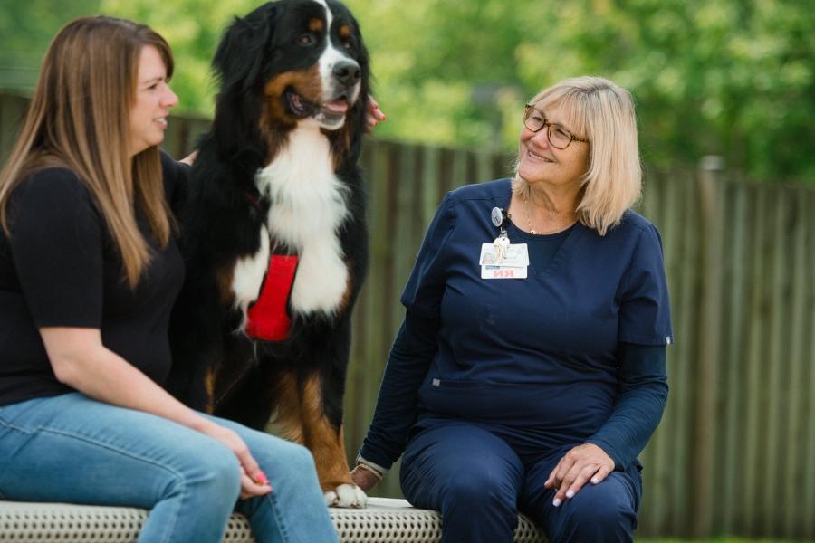 Nurse with patient and therapy dog